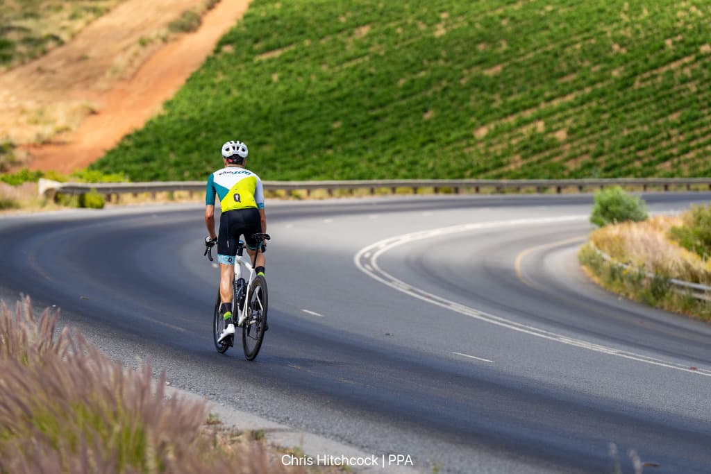 Club100 rider on a winding Cape road